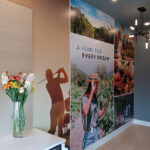 Full Color wall image of communities amenities of golfing, wineyard, wine tasting, and family hiking.