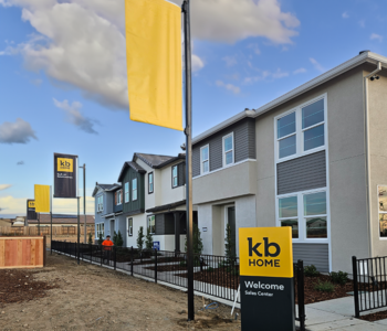 KB Home's banner flag and Sales Center sign.