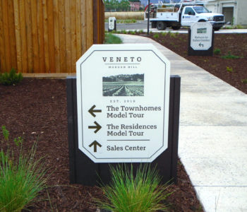 Directional sign on property to direct foot-traffic to sales office.