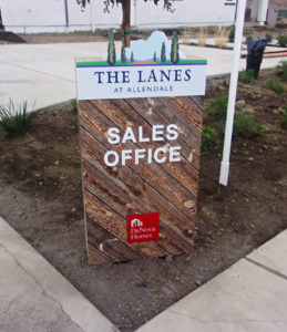 Wood sign identifying the location of the Sales Office