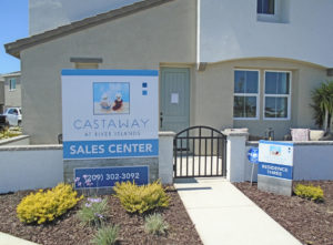 Front facade of Castaway's sales center, featuring two signs flanking the entrance.
