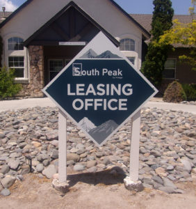 Diamond shaped outdoor sign identifying the Leasing Office