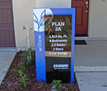 Large Portrait box sign installed outside home to ID its square footage, bedrooms & bathrooms.