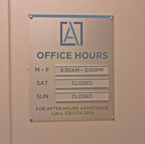Office house sign on wall with interchangeable hours