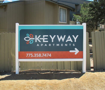 Sign with arrow to give direction in apartment complex.