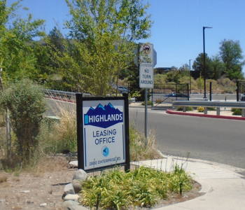 Directional sign placed on the corner of street. Directing to leasing office.