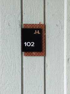 Sign installed on building of room 102.